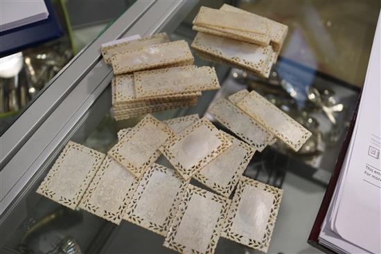 A part set of 56 19th century Chinese mother of pearl gaming counters, in four sizes, Largest 2.75in.